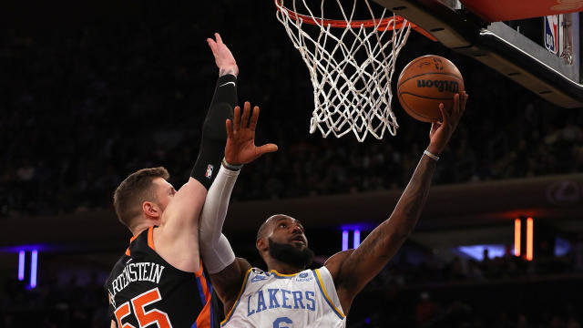 LeBron James #6 of the Los Angeles Lakers heads for the net as Isaiah Hartenstein #55 of the New York Knicks defends in the final minutes of the game at Madison Square Garden on January 31, 2023 in New York City. 