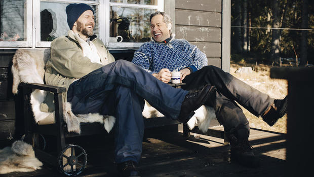 men sitting outside in winter 