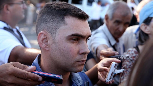 Cuban shipwreck survivor Gonzalez speaks to the press as he arrives to pay tribute to Cuba's late President Castro at the Jose Marti Memorial in Revolution Square in Havana 