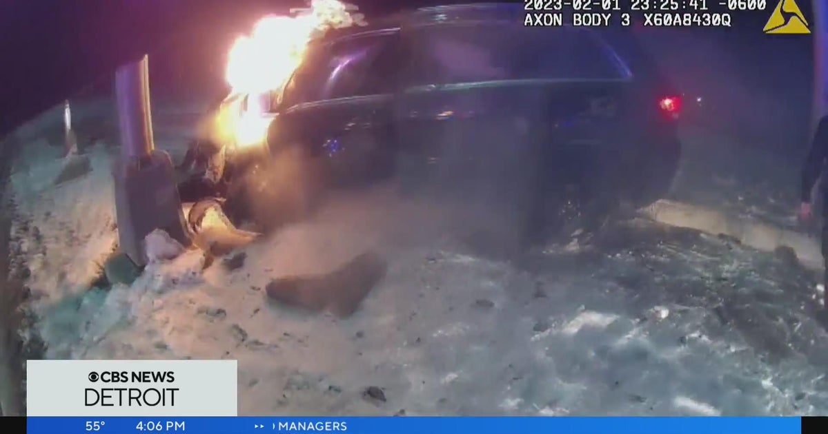Caught on Camera: Wyandotte police rescue suspect in fiery crash - CBS ...
