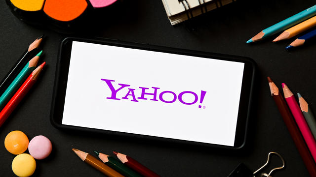 In this photo illustration a Yahoo logo seen displayed on a 
