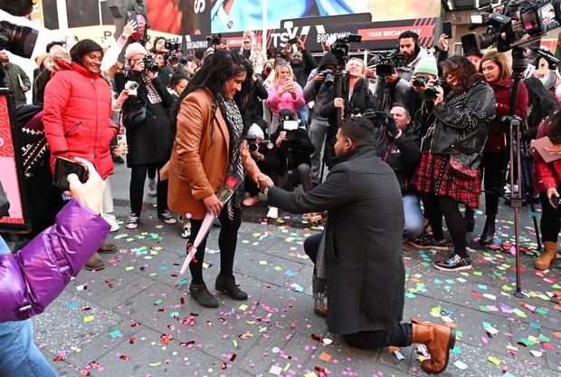 David Machado proposes to Sarah Persaud during a Valentine's Day celebration in New York City's Times Square on February 14, 2023. 