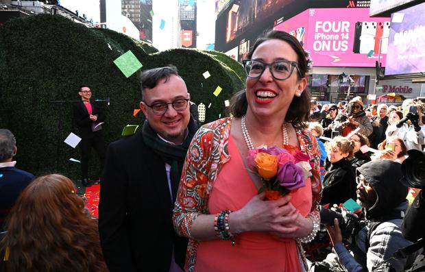 Rachel Federman and Alexandre Perez leave after getting married during Valentine's Day in New York City's Times Square on February 14, 2023. 