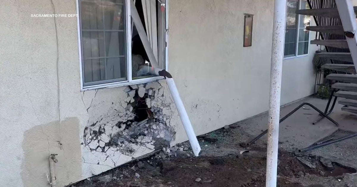 2 people inside Sacramento apartment building hurt after vehicle crash