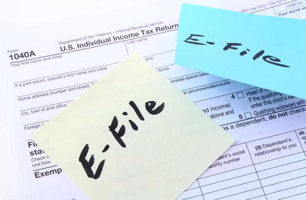 Tax form 1040A with E-file sticky notes 