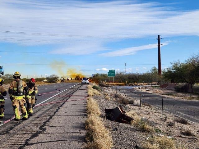 A truck carrying hazardous nitric acid overturned on an Arizona highway