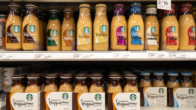 Bottles of Starbucks Frappuccino coffee drinks on a store shelf 