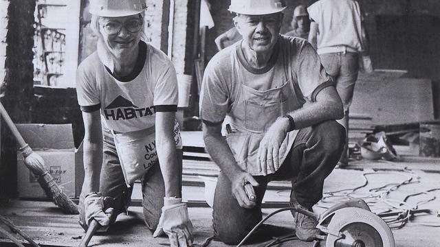 Rosalynn and Jimmy Carter at work renovating a tenement on the East 6th Street in the East Village in Manhattan on September 4, 1984. 