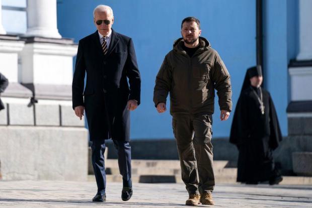 President Biden walks with Ukrainian President Volodymyr Zelenskyy at St. Michael's Golden-Domed Cathedral during an unannounced visit in Kyiv on Feb. 20, 2023. 
