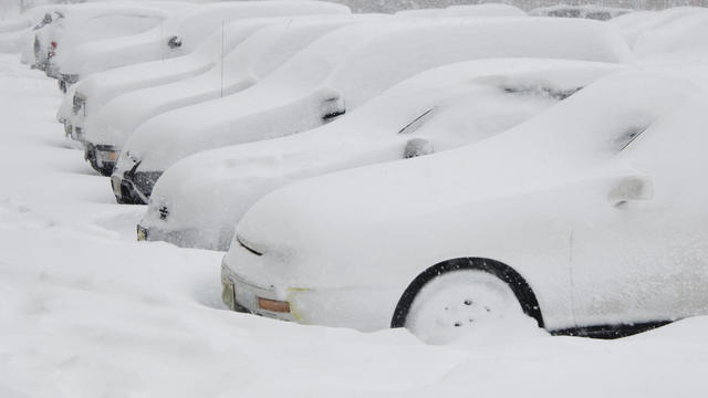 Cars buried in snow 