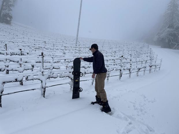 CADE Assistant Winemaker Bobby Kloetzer snowboarding after snow storm 
