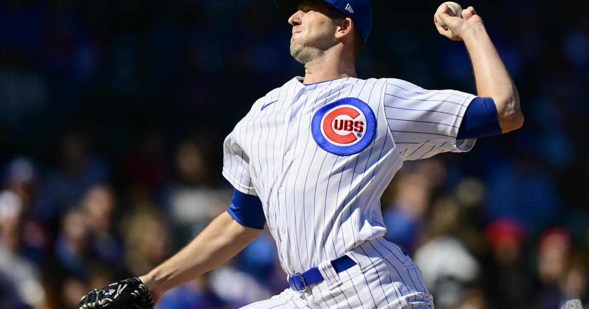 Chicago Cubs' Dansby Swanson watches the flight of the ball during