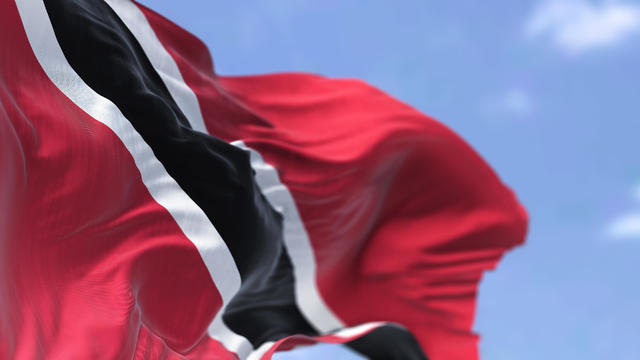 Detail of the national flag of Trinidad and Tobago waving in the wind on a clear day 