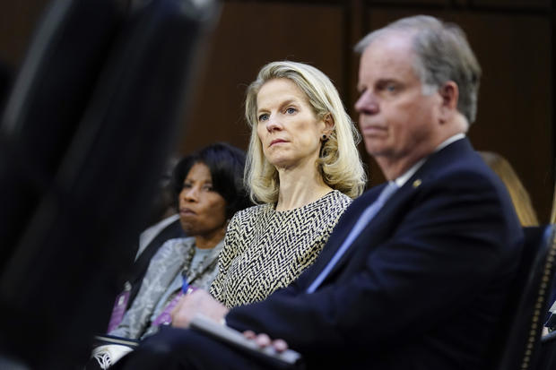 White House counsel Dana Remus, center, listens during a confirmation hearing for Supreme Court Ketanji Brown Jackson before the Senate Judiciary Committee on Tuesday, March 22, 2022. 