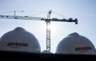 Crane with two hard hats in foreground 