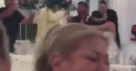 Video displays male waiving gun at wedding day attendees at Cielo Farms Nursery