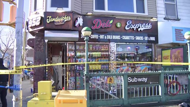 A Brooklyn bodega is blocked off by crime scene tape. 