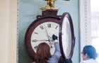 Capitol workers wind the Ohio Clock in the U.S. Capitol in Washington, D.C., on Jan. 21, 2020. 