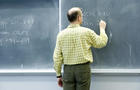 Teacher giving French lessons on the blackboard 