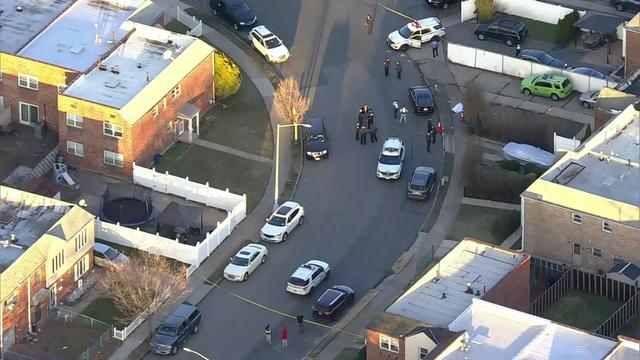 An aerial shot of a Staten Island street blocked off by crime scene tape. 