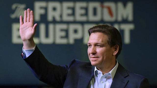 Florida Gov. Ron DeSantis waves to the crowd as he attends an event Friday, March 10, 2023, in Davenport, Iowa. 