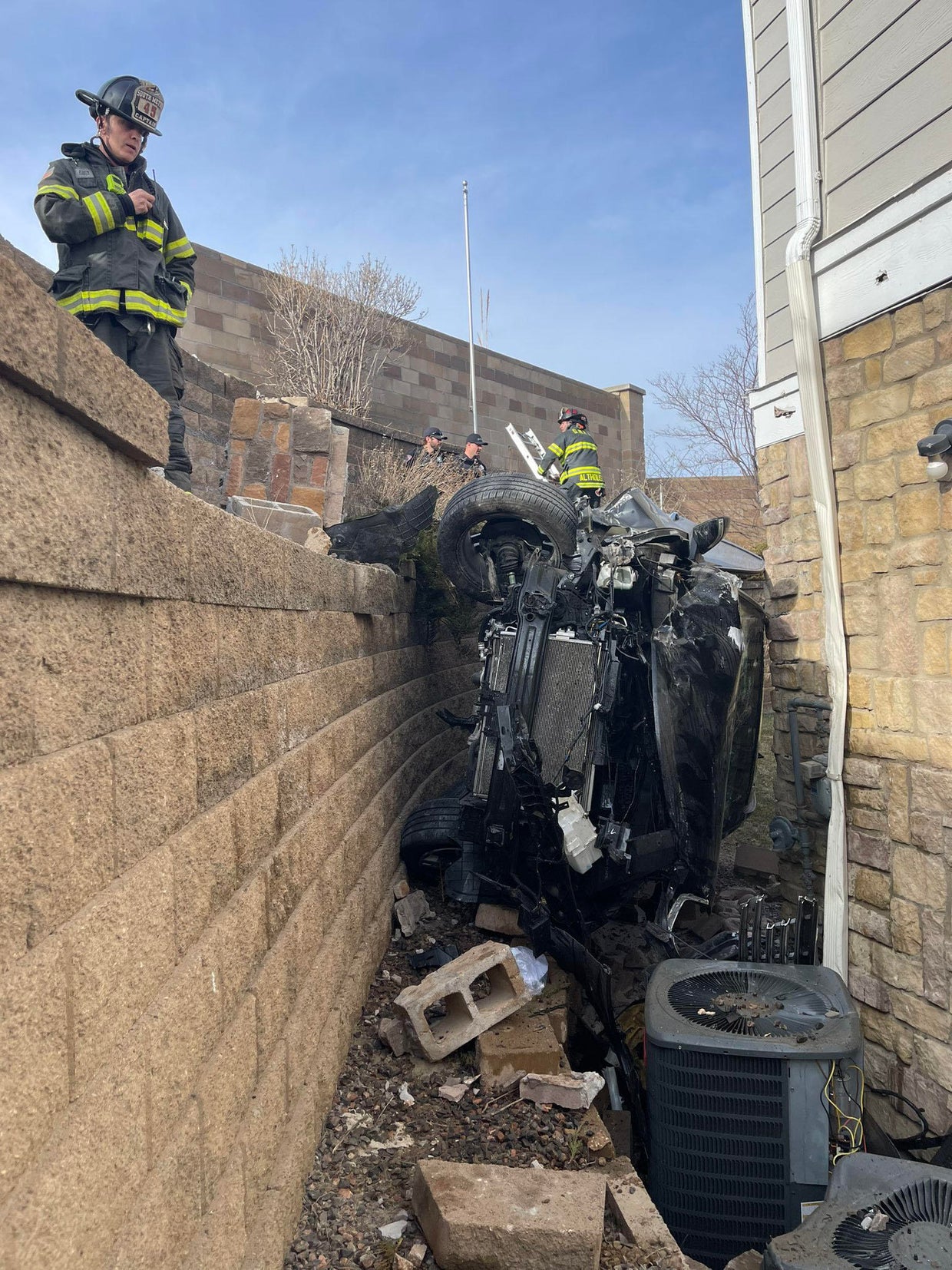 Driver seriously injured after crashing into apartment building in ...