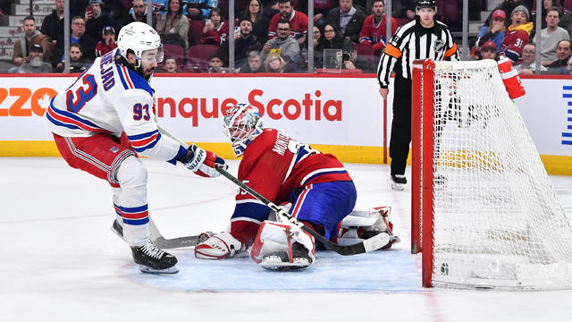 Mika Zibanejad #93 of the New York Rangers scores the game winning goal during the shootout on goaltender Sam Montembeault #35 of the Montreal Canadiens at Centre Bell on March 9, 2023 in Montreal, Quebec, Canada. 