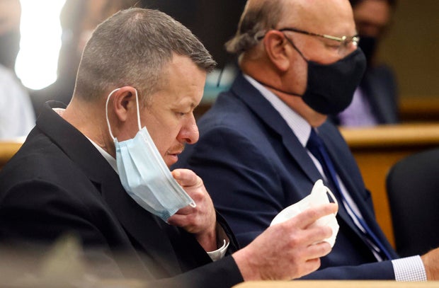 Paul Flores puts on a new N95 mask Aug. 3, 2021, at a preliminary hearing in San Luis Obispo, Calif., as he faces a murder charge in the disappearance of Kristin Smart.