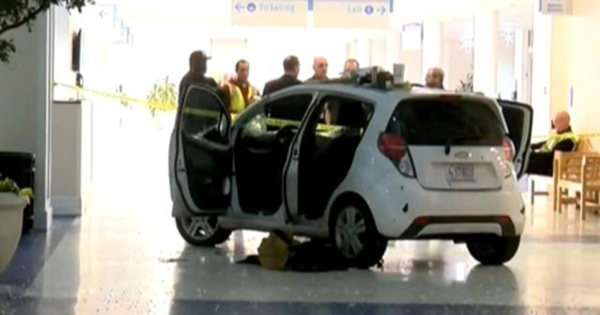 Driver crashes car into North Carolina airport terminal