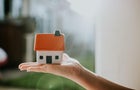 Hand holding House 