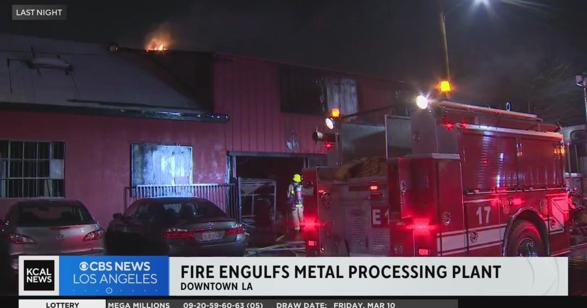 Nearly 100 firefighters tackle Greater Alarm fire at metal processing plant in Downtown LA