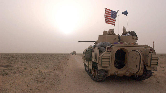 U.S. Army 3rd Division 3-7 Bradley fighting vehicles take up a position along a road on March 19, 2003, inside the demilitarized zone between Kuwait and Iraq. 