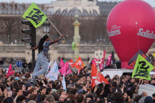 Protesters march in Paris against pension reform plan 