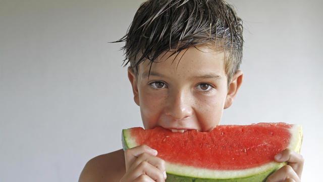 Boy eating watermelon 