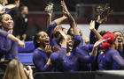 Members of Fisk University's women's gymnastics program cheer during an NCAA meet in Las Vegas 