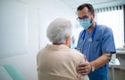 Older woman talks with doctor 