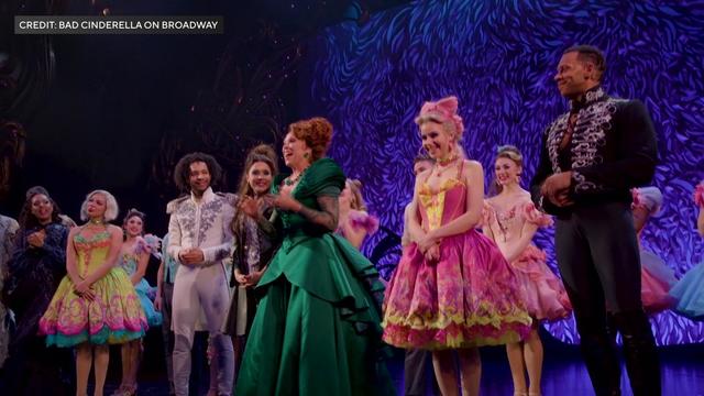 A cast of Broadway's "Bad Cinderella" stands on stage. 