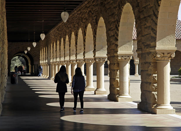 Students walk on the Stanford University campus 