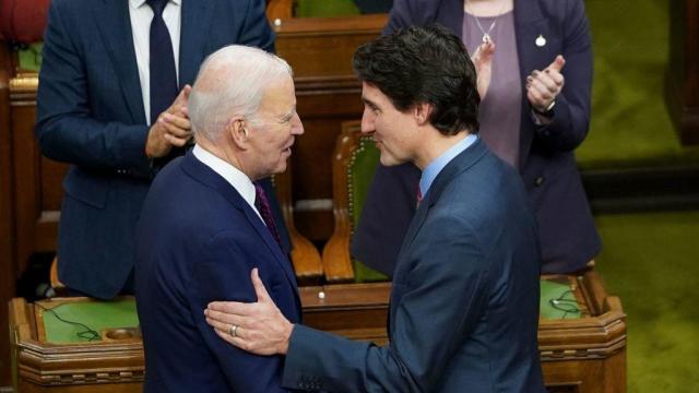 President Biden shakes hands with Canadian Prime Minister Justin Trudeau at the Canadian Parliament in Ottawa on March 24, 2023. 