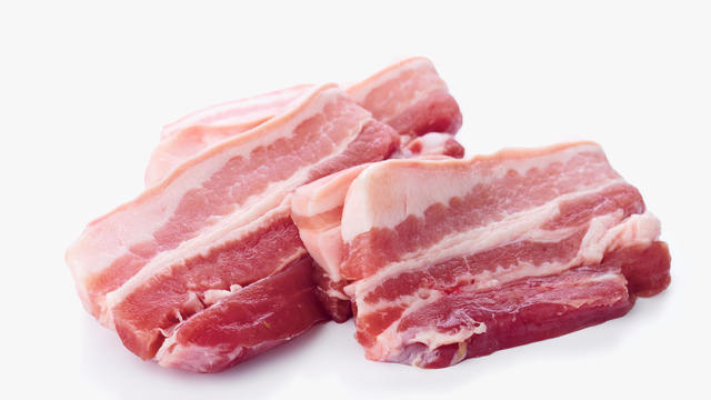 Raw pork belly fillets directly on the white background 