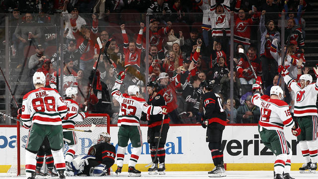 Kevin Bahl #88, Jack Hughes #86, Jesper Bratt #63, Ondrej Palat #18 and Dougie Hamilton #7 of the New Jersey Devils celebrate a goal by Hamilton as Dylan Ferguson #34 of the Ottawa Senators looks on during the third period at Prudential Center on March 25 