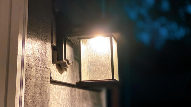 illuminated outdoor porch light sconce fixture 