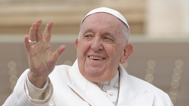 Pope Francis waves from the "popemobile" as he leaves St. Peter's Square on March 29, 2023, at The Vatican to hold his weekly general audience. 
