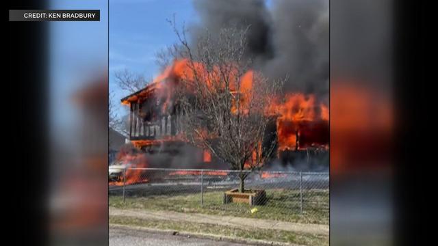 A home fully engulfed in flames. 