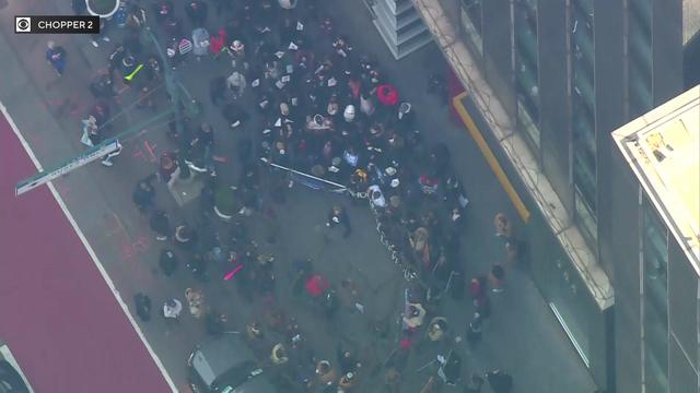 An aerial view of dozens of protesters gathered outside Gov. Kathy Hochul's Manhattan offices. 