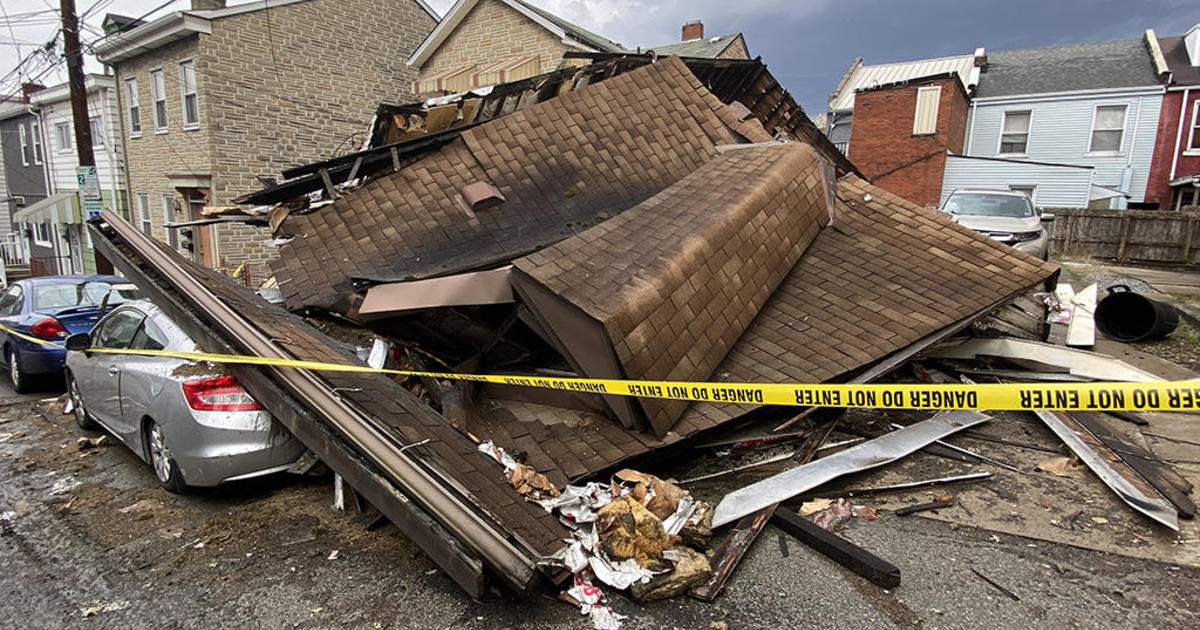 Cars damaged after South Side building collapses