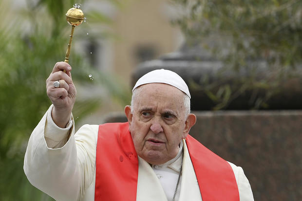 Pope Francis blesses faithful with olive and palm branches before celebrating Palm Sunday Mass in St. Peter's Square at The Vatican, April 2, 2023, a day after being discharged from the Agostino Gemelli University Hospital in Rome, where he was treated for bronchitis, the Vatican said. 