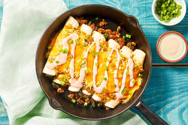 One-Pan Turkey Enchiladas Verdes with Mexican Cheese & Hot Sauce Crema 