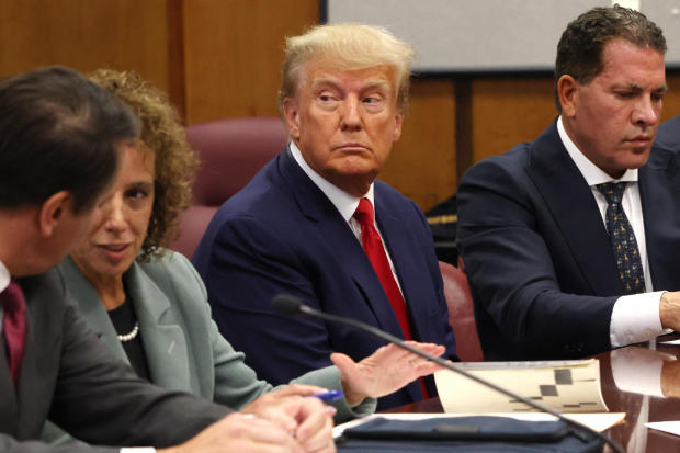 Former President Donald Trump appears in court with members of his legal team for an arraignment on charges stemming from his indictment by a Manhattan grand jury following a probe into hush money paid to adult film star Stormy Daniels in New York City, April 4, 2023. 