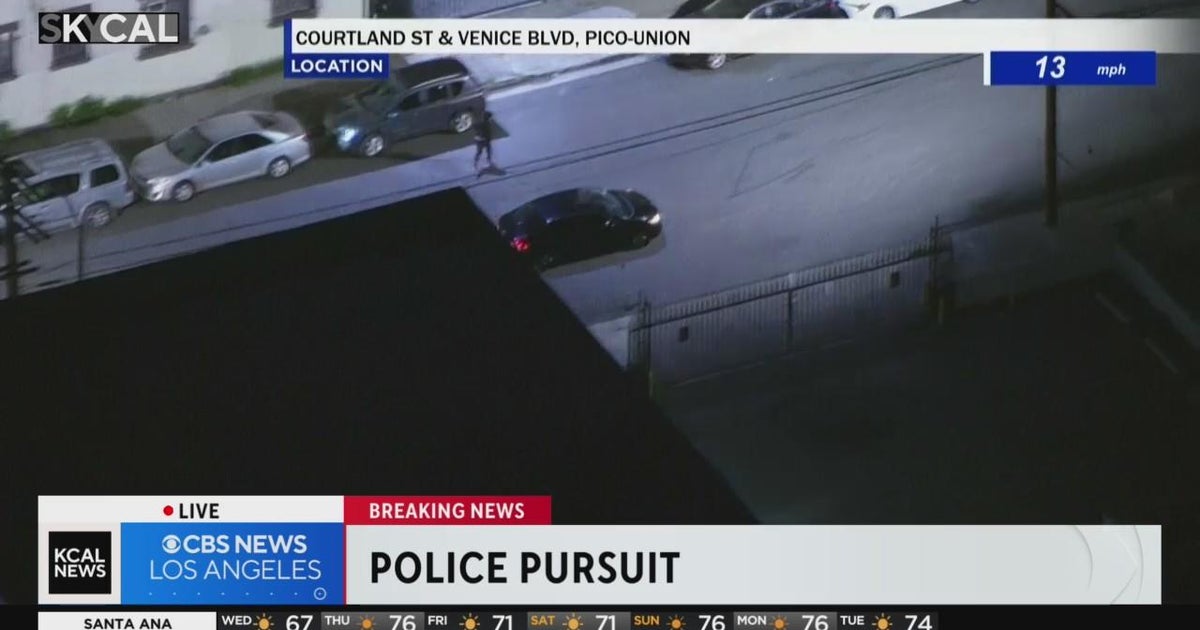 Another passenger jumps out of pursuit vehicle after spike strip CBS